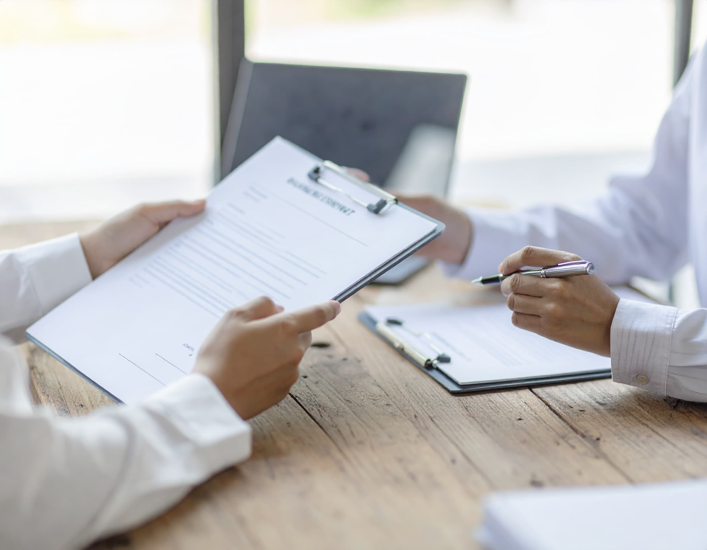 Annual filing documents being reviewed on a professional desk